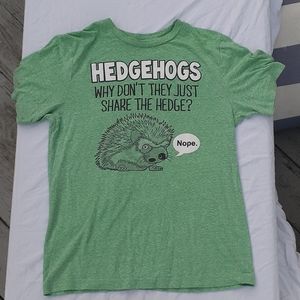 A green tshirt with a hedgehog joke on the front